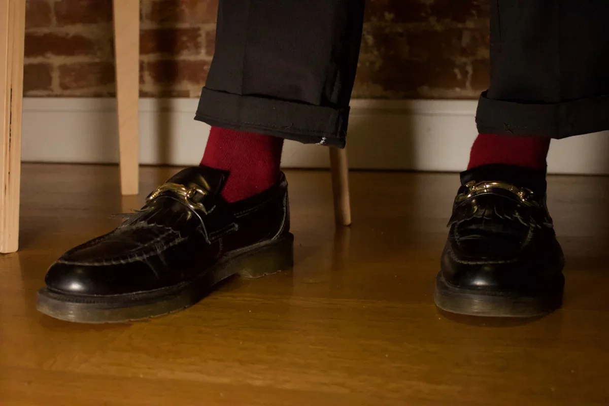 Burgundy socks worn with black boots