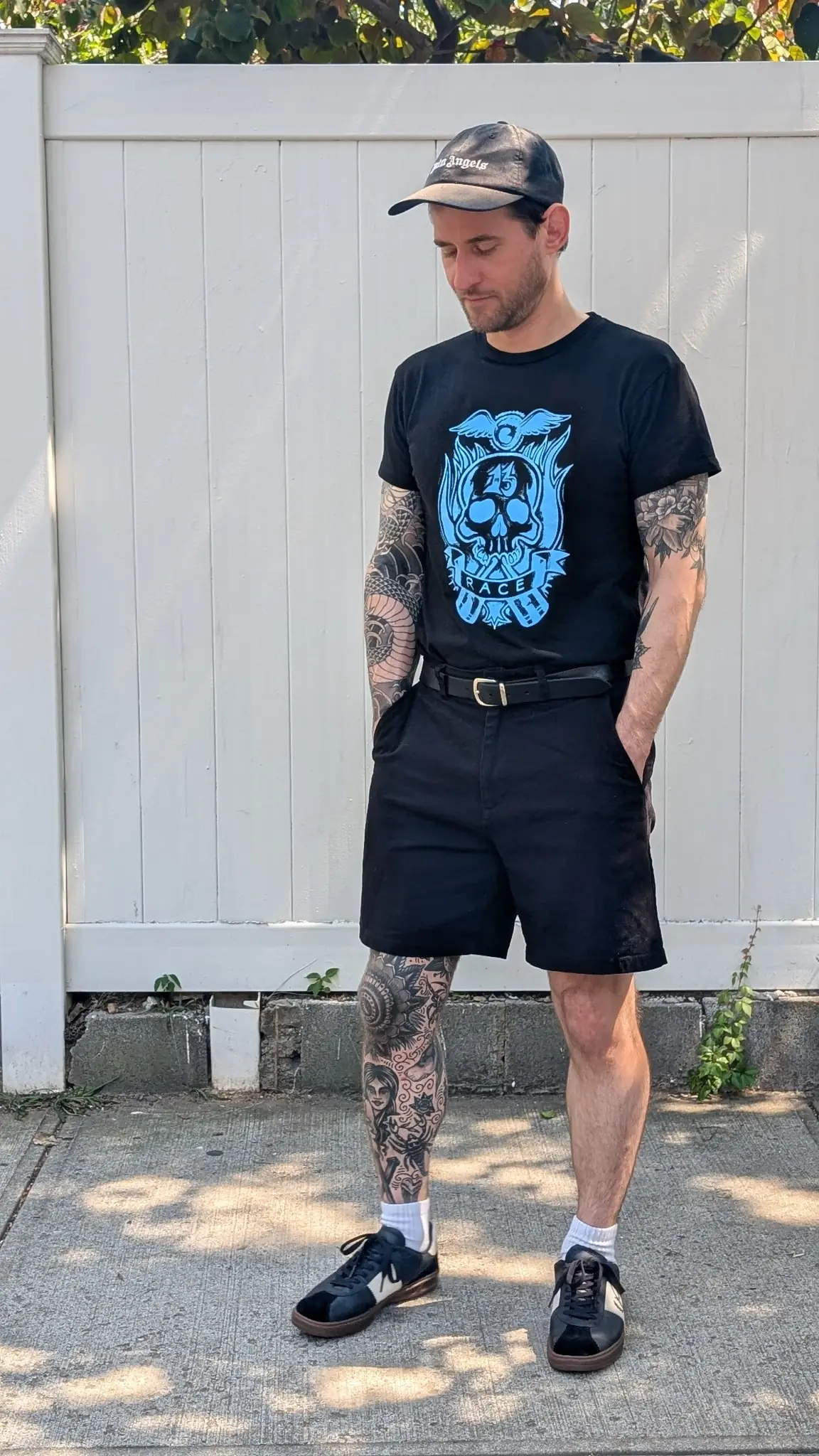 Black trouser shorts with a graphic tee and creepers