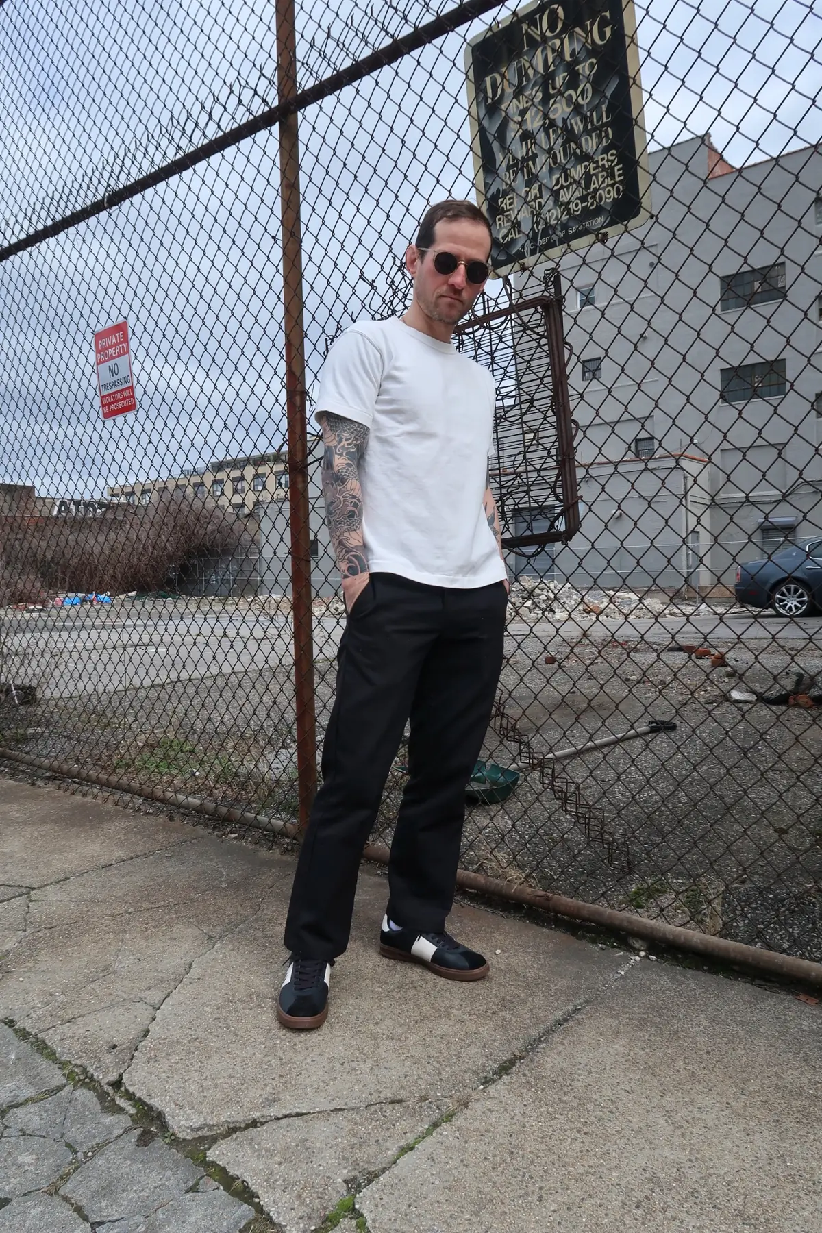 White tee with relaxed black trousers and black sneakers