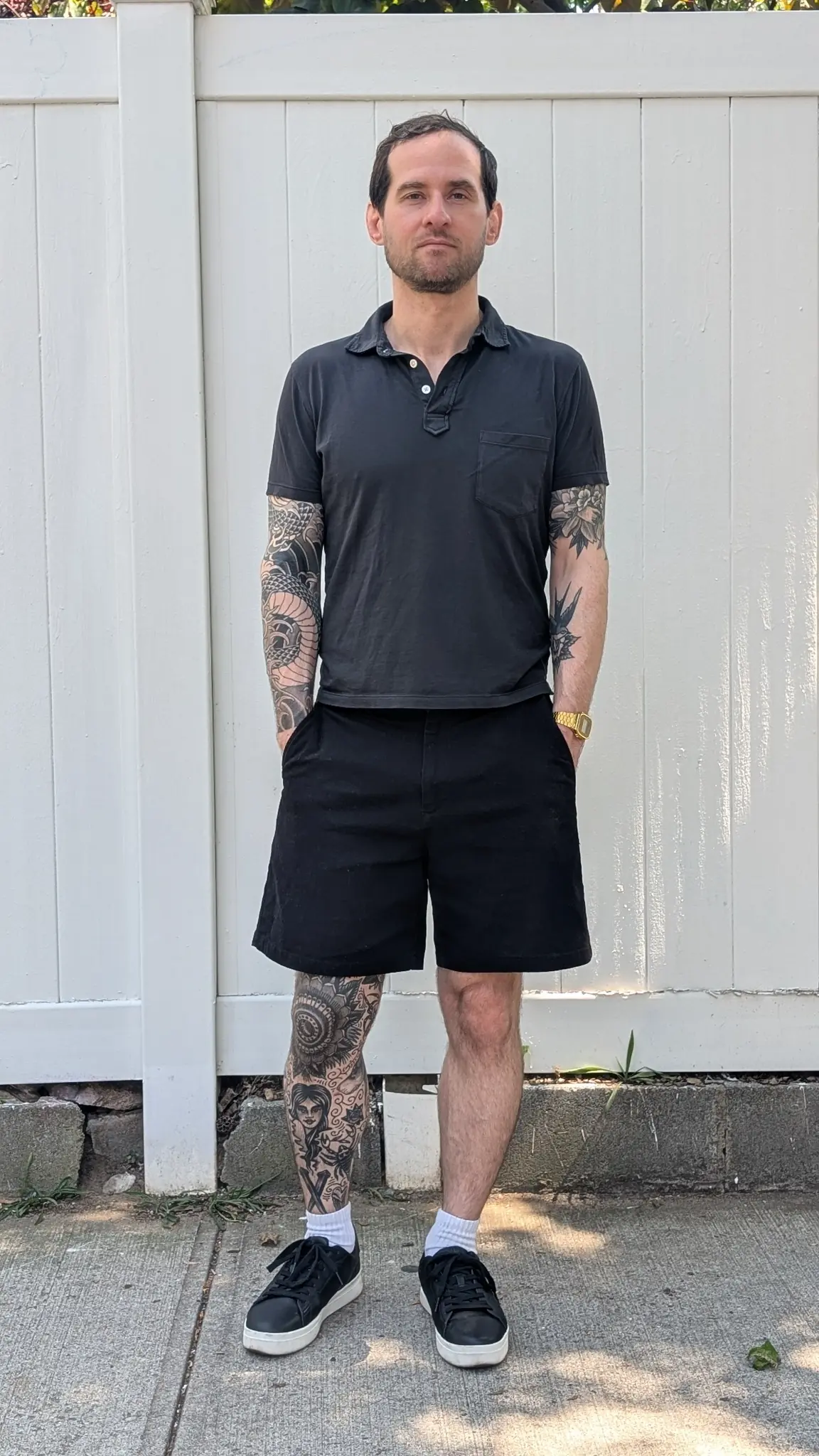 Black trouser shorts with a dark blue polo