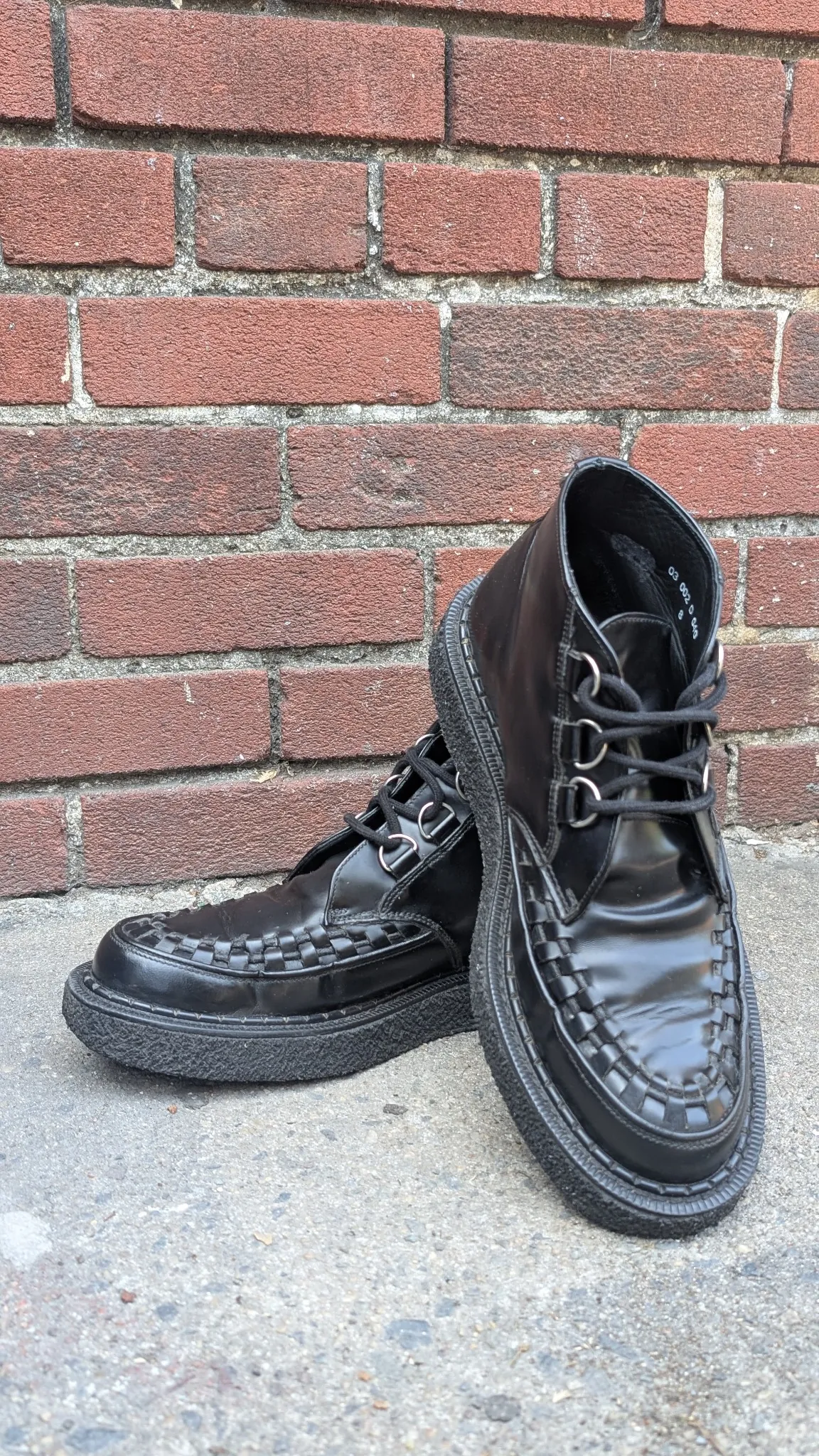 Closeup of George Cox Creepers with red socks