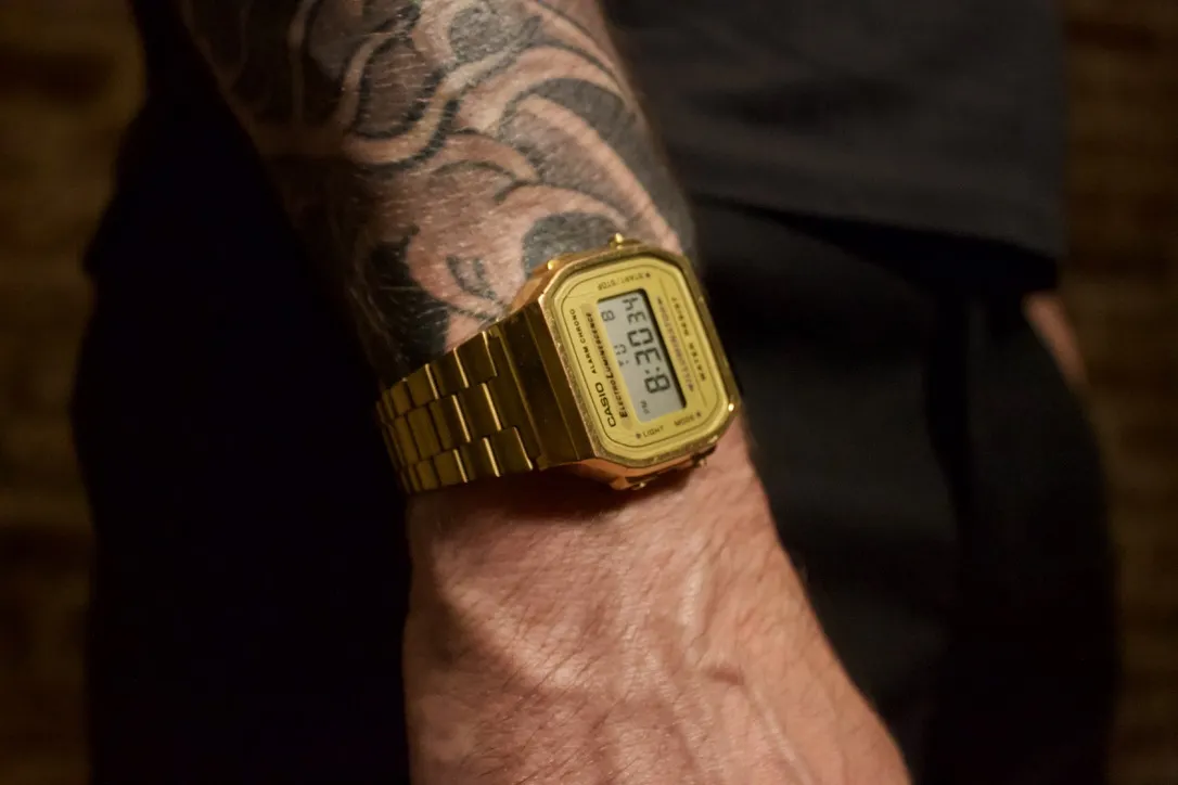 Slim gold Casio watch on wrist
