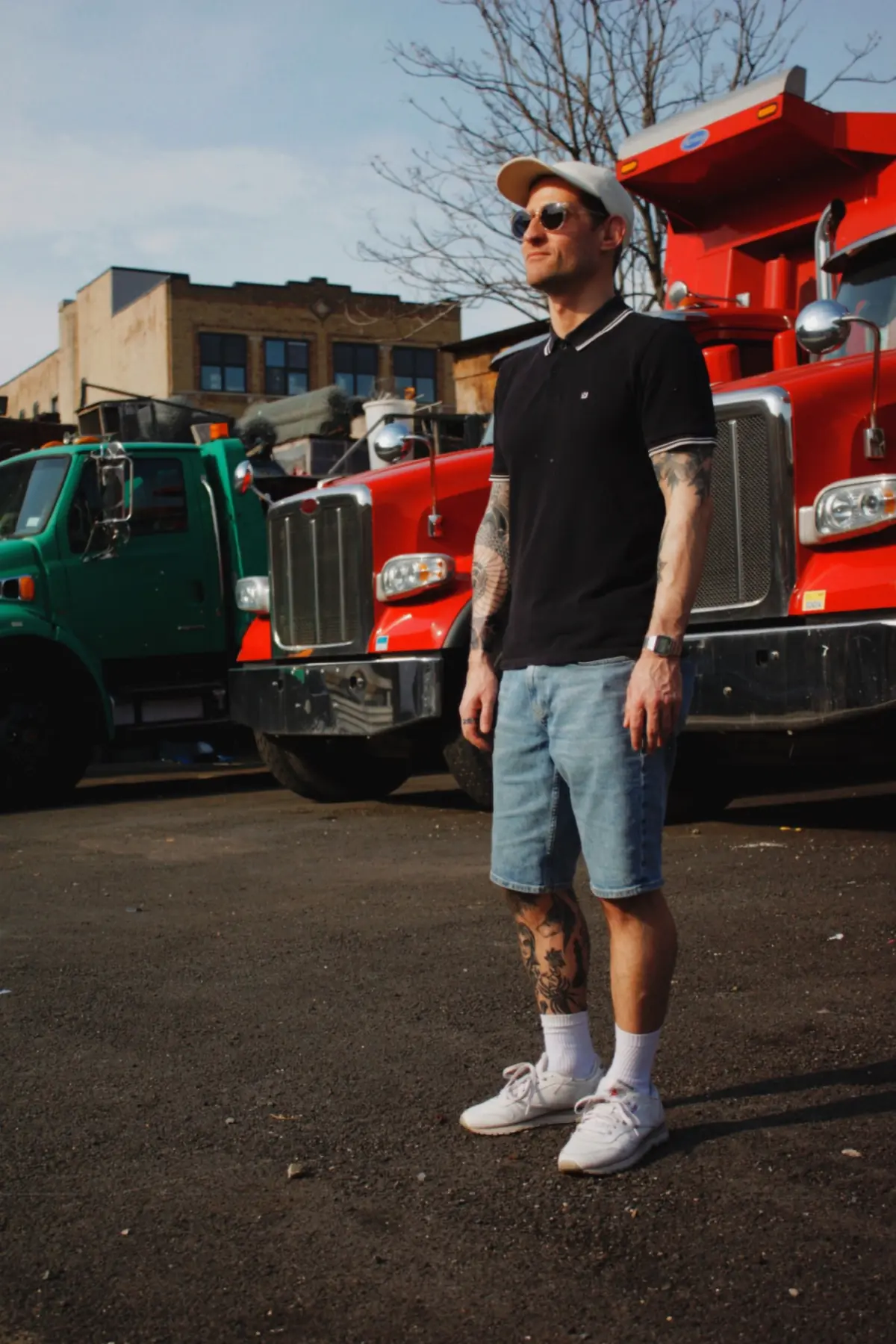 Navy tipped polo with light denim shorts, white socks and sneakers