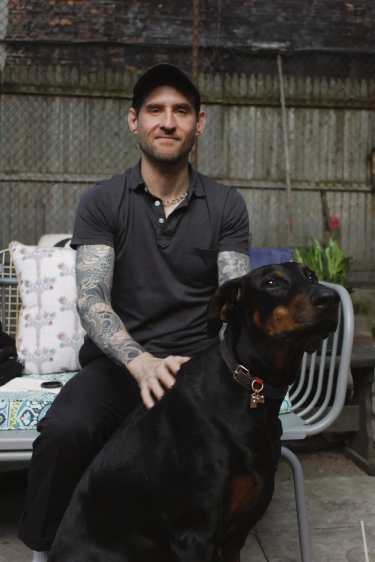 Charcoal short-sleeve button-up with dark pants, minimal summer outfit