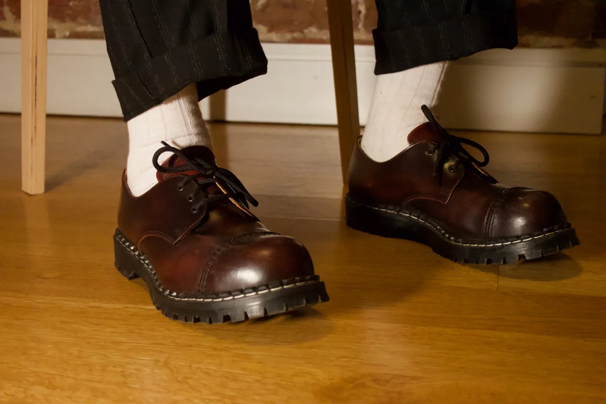 Thick white socks with black creepers and pinstripe trousers